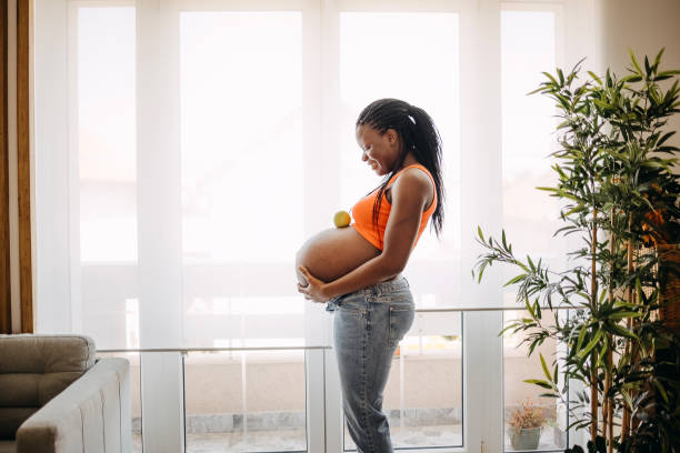 istock Pregnant woman holds her belly 1413331844