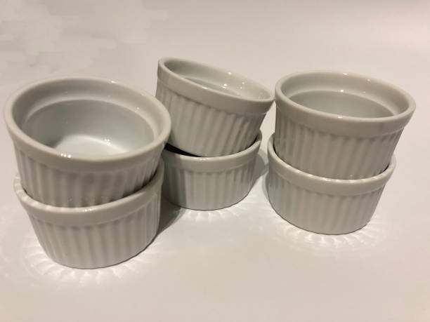 istock Half a dozen pieces of small, white ramekins for baking 1413332029