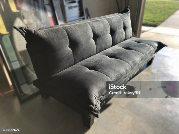 Black Foldable Futon Bed Set Out In A Garage Stock Photo - Download Image Now - Futon, Sofa, Apartment