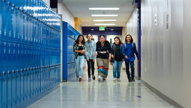 istock A group of middle and high school kids walking on a corridor 1413335526