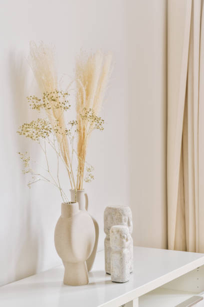 istock Candles on table near potted plant 1413336948