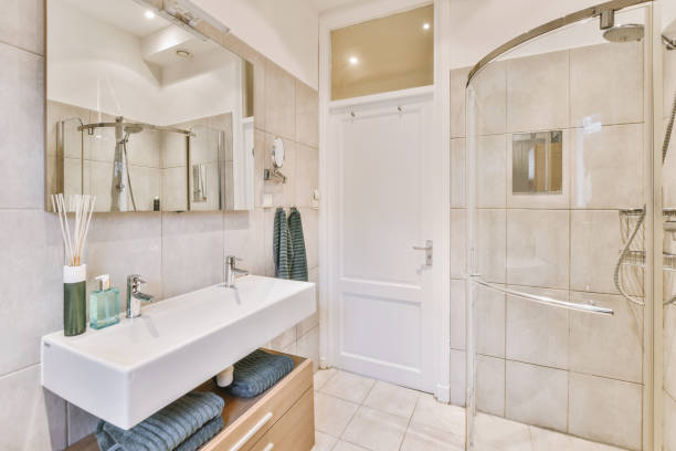 istock Sinks and bathtub near shower cabin 1413336955