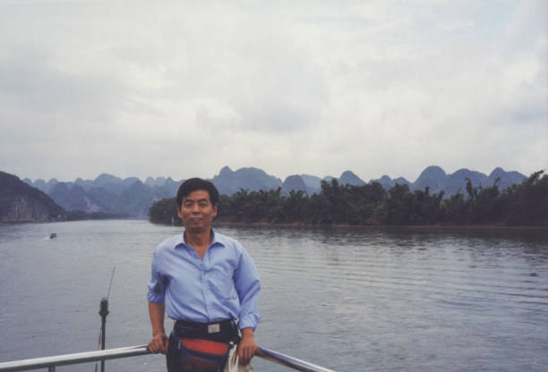 istock 1990s Chinese Men Real Life Old Photo 1413337064