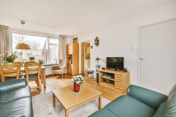 istock Spacious modern room with lounge and dining areas 1413339381