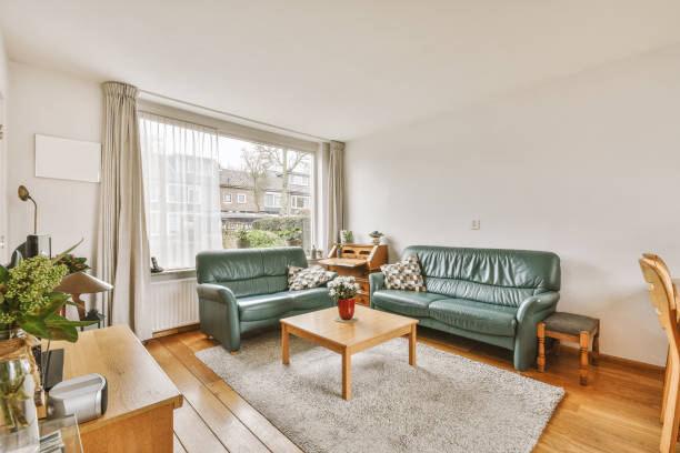 istock Spacious modern room with lounge and dining areas 1413339382