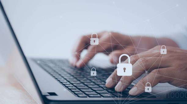 istock Internet security and data protection concept, blockchain, cybersecurity. Man working on his laptop in office, select icon security on the virtual display. Business, technology, networking concept. 1413346942