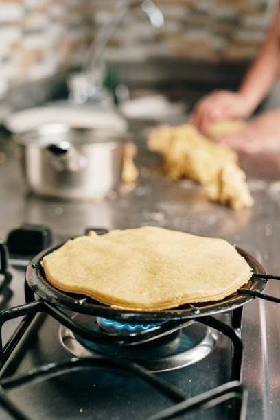 istock Cooking Colombian Arepas on a grill 1413346947