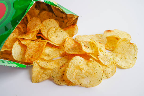 istock Potato chips in open bag, delicious BBQ seasoning spicy for crips, thin slice deep fried snack fast food in open bag. 1413355731
