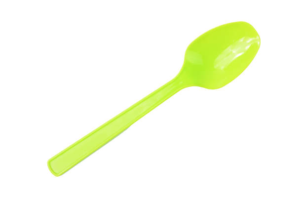 istock Green spoon isolated on a white background 1413356667