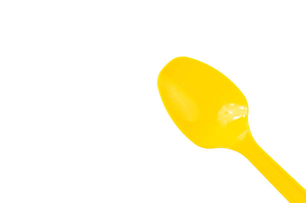 istock Yellow spoon isolated on a white background 1413356672