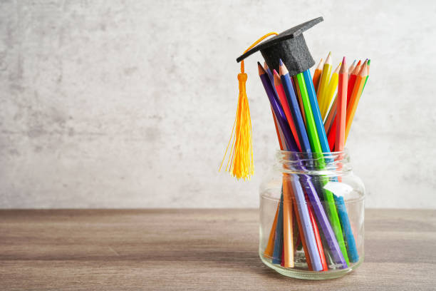 istock Graduation hat with colorful pencils on book with copy space, learning university education concept. 1413357709