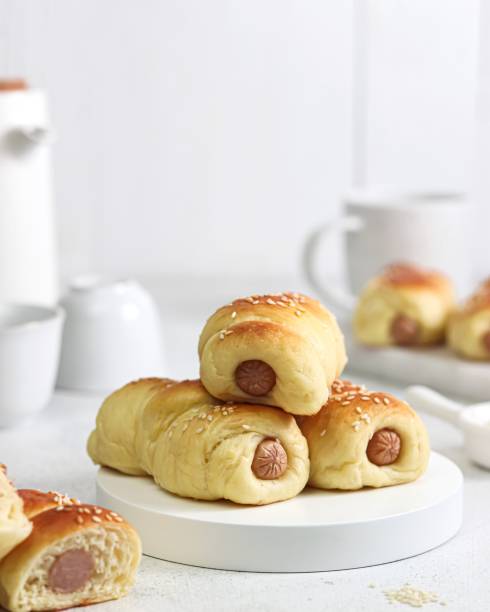 istock Sausage bread served on a white cutting board 1413358758