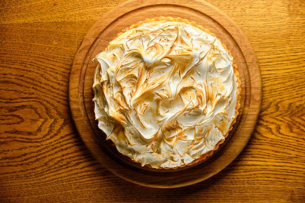 istock Large white souffle cake, airy with caramel 1413361602