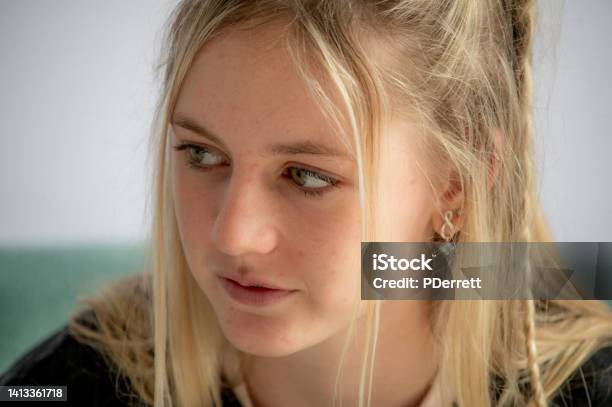 Upset Young Woman Contemplates What Has Been Said And What She Should Do Stock Photo - Download Image Now