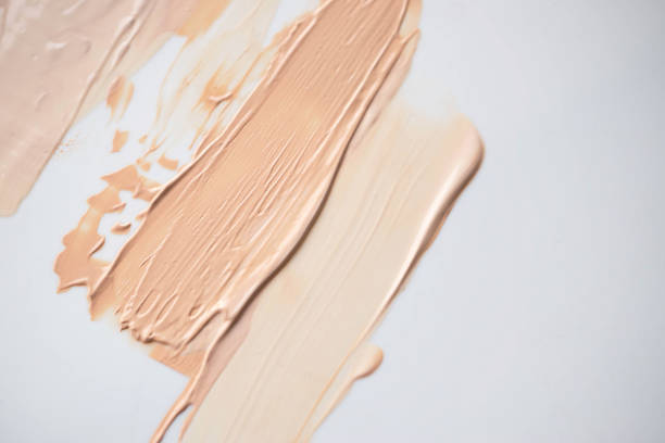 istock Close up of  foundation texture.Two tone colors on white background. 1413361751