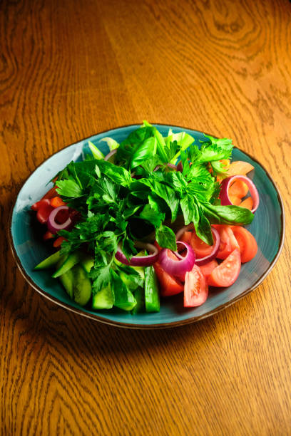 istock Chopped vegetables and herbs on a plate 1413362448