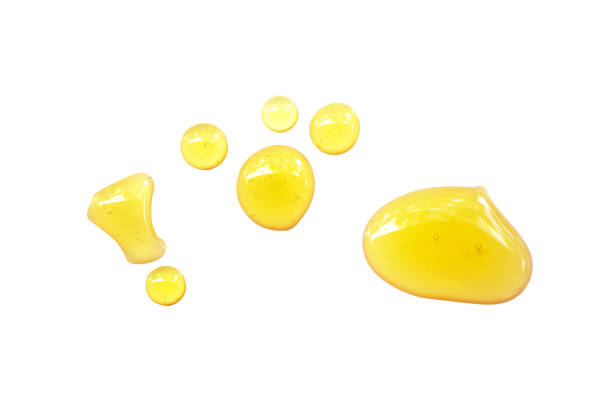 istock Honey drops isolated on white background.File contain clipping path. 1413362497