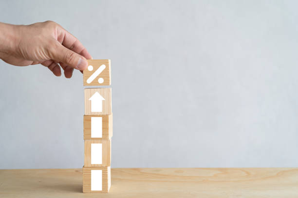 istock Hand putting wooden cubes block which print screen increase or up white arrow. 1413362517