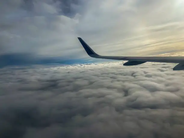 airplane wings above the clouds