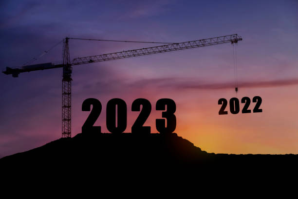 istock Silhouette of engineer and construction to create lifting crane 2023 on blue sky background. 1413366433
