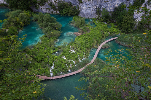 Germany, Tourist destination of blautopf source blue water in blaubeuren forest in swabian jura nature landscape in summer with sun