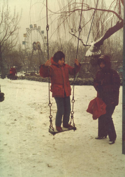 1980s Chinese Little Girl and Mother in Snow Photo of Real Life 1980s Chinese Little Girl and Mother in Snow Photo of Real Life chinese ethnicity photos stock pictures, royalty-free photos & images