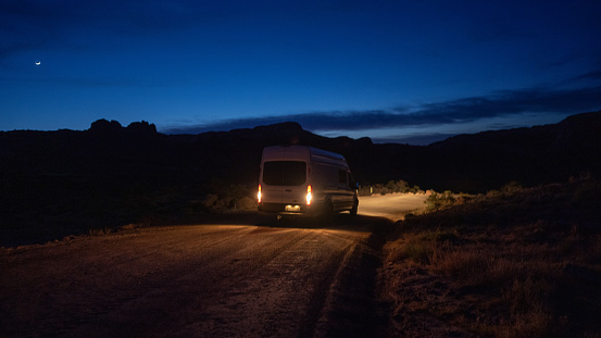 an driving down a dirt road at night in Utah, USA