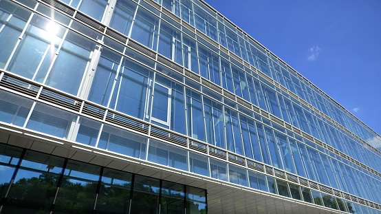 Low angle view of the glass facade of an office building.