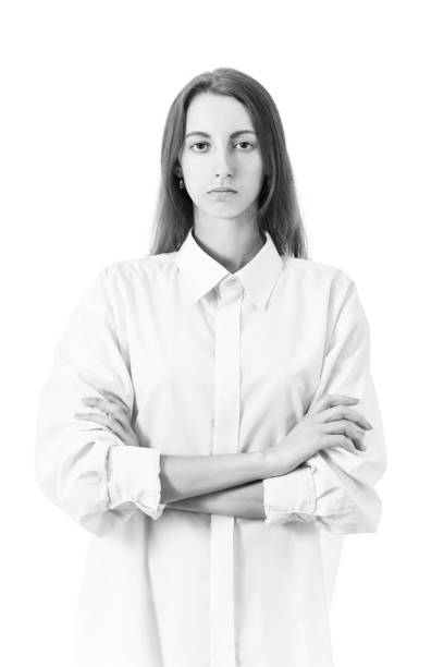 silhouette studio portrait of a beautiful brunette girl with short hair against white background.