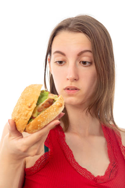 istock girl with hamburger 1413385679