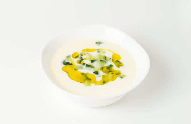 Isolated photo on a white background of salted yogurt with cucumbers stock photo