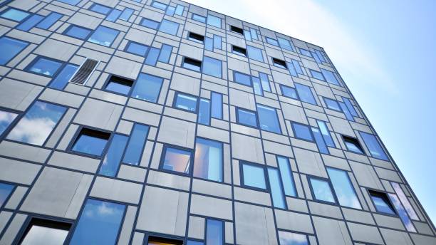 istock Modern glass building facade in sunny day. Business background. 1413388436