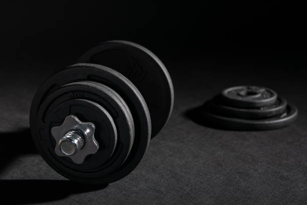 istock Weight training dumbbell kit with some cast iron weight plates 1413390984