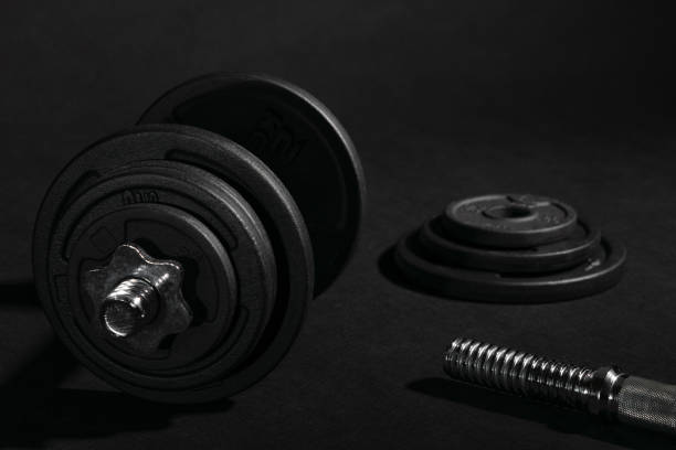 istock Weight training dumbbell kit with some cast iron weight plates 1413390985