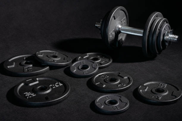 istock Weight training dumbbell kit with some cast iron weight plates 1413390991