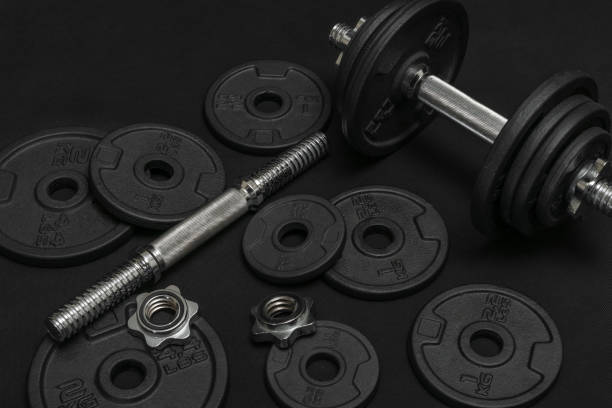 istock Weight training dumbbell kit with some cast iron weight plates 1413390993