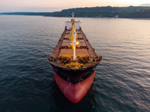 istock Large general cargo ship tanker bulk carrier, aerial view at night. 1413391956