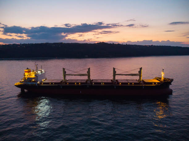 istock Large general cargo ship tanker bulk carrier, aerial view at night. 1413391972