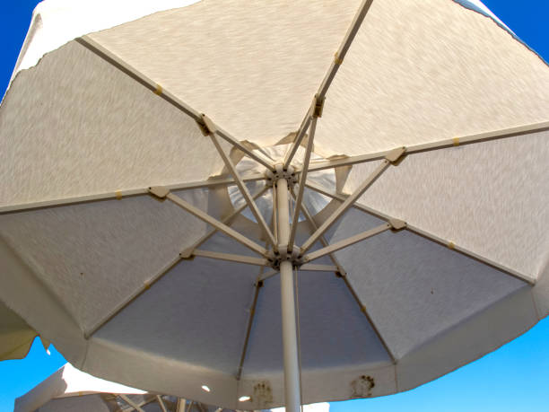 istock Beach umbrella against blue sky 1413393347