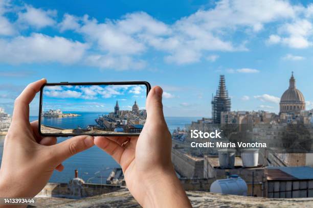 Tourist Taking Photo Of Valletta Harbor With Valletta Old Town And Sliema Valletta Malta Stock Photo - Download Image Now