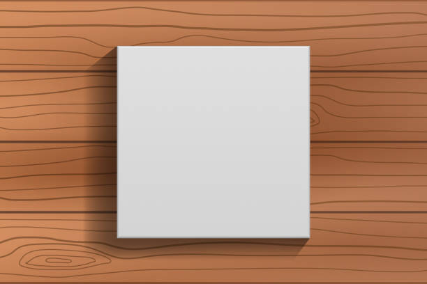 белая пустая холщовая рамка на коричневом деревянном фоне пола - canvas artists canvas white frame stock illustrations