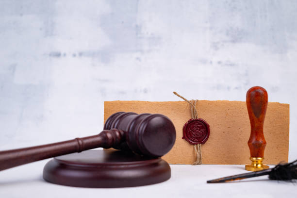 istock Notary's public pen and stamp on testament and last will. Notary public tools 1413395434