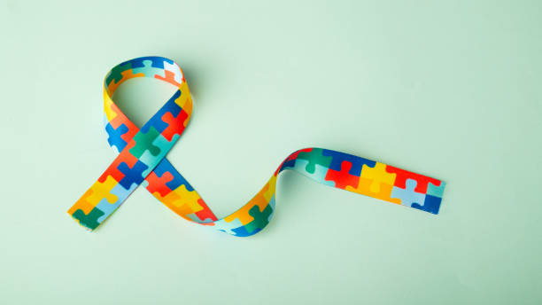 istock World Autism awareness and pride day with Puzzle pattern ribbon 1413395549
