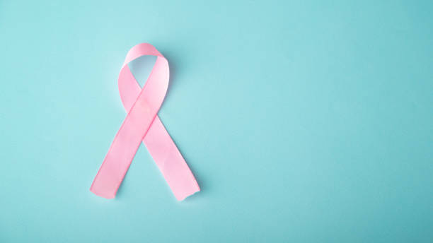 istock pink ribbon breast cancer on blue background 1413395570