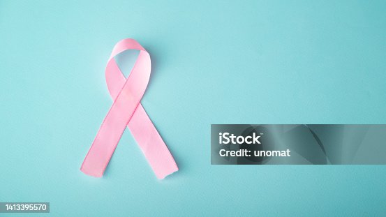 istock pink ribbon breast cancer on blue background 1413395570