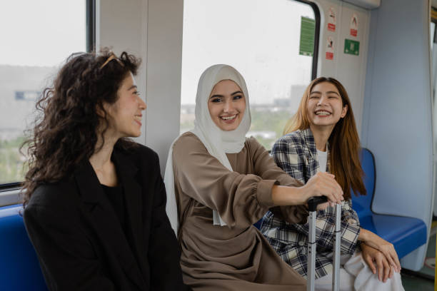 istock Multi-ethnic business people travel by train. 1413396675