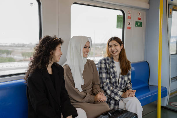 istock Multi-ethnic business people travel by train. 1413396688