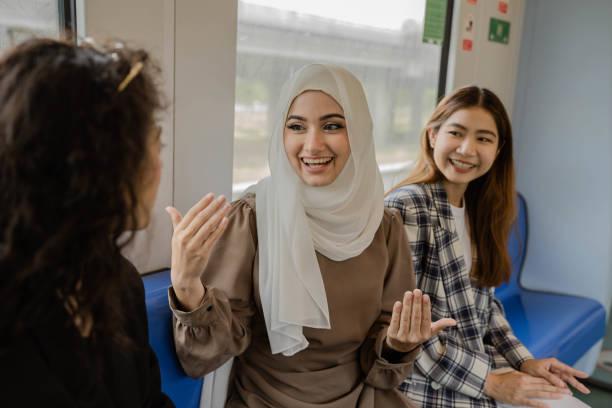 Multi-ethnic business people travel by train.