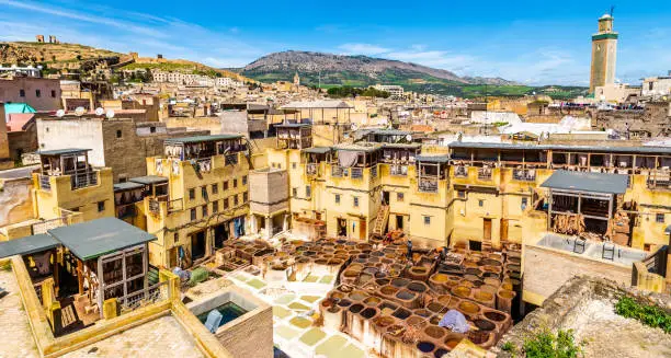 Old tanks of the Fez's tanneries with color paint for leather. Chouara tannery, Fez, Morocco, Africa. Artistic picture. Beauty world
