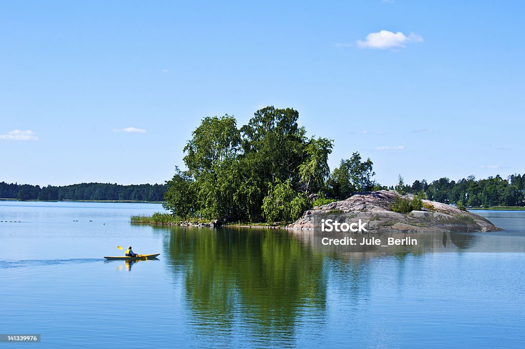 Finnish scenery peaceful finnish scenery in Helsinki with a canoe in the distance Blue Stock Photo